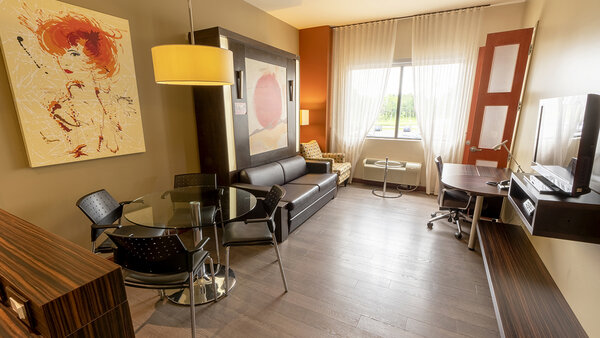 Spacious Suite with three double beds, 3 separate rooms and a fully-equipped kitchenette, offering comfort and convenience at the Must Hotel.
