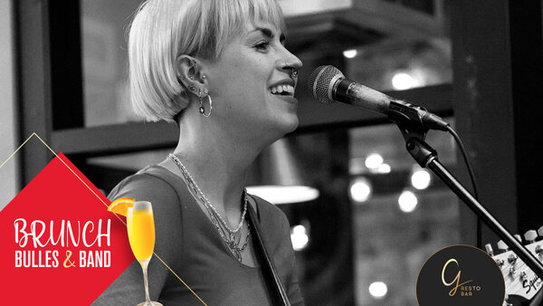 Cassandre Picard smiles, plays guitar and sings during a 'Brunch Bulles & Band' musical performance at the Hôtel Palace.